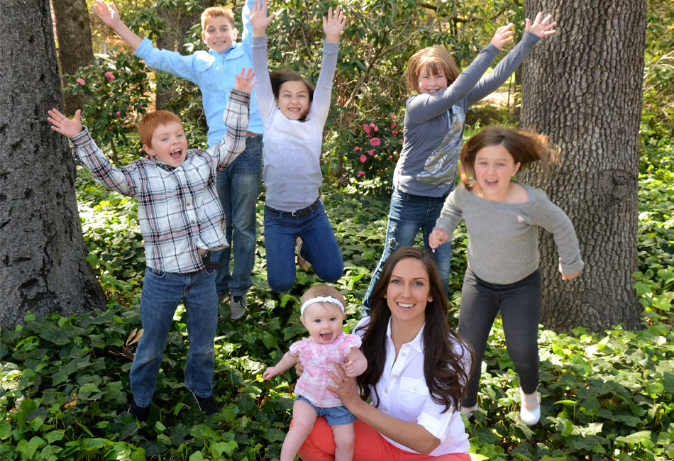Pediatric dentist Dr. Patrice Espinosa and a group of jumping kids